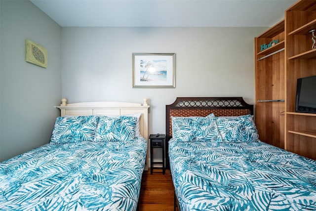 bedroom featuring dark hardwood / wood-style floors