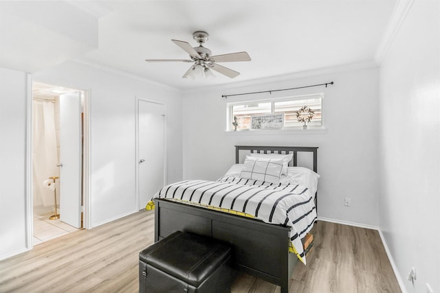 bedroom featuring ceiling fan, ornamental molding, connected bathroom, and light wood-type flooring