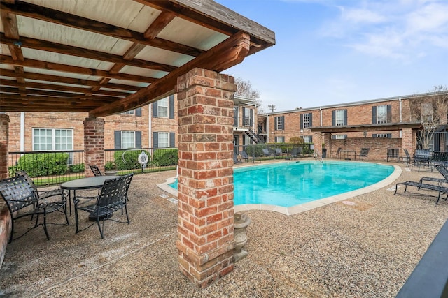 view of swimming pool with a patio