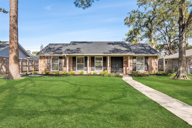 ranch-style house featuring a front lawn