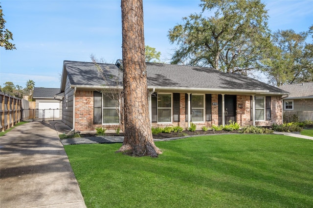 view of front of house with a garage and a front lawn