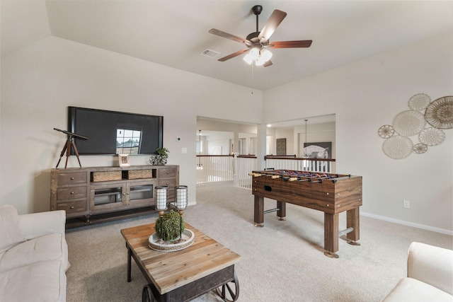 game room with lofted ceiling, ceiling fan, and carpet flooring