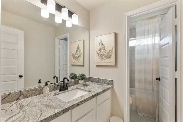 full bathroom with vanity, toilet, and shower / bath combo with shower curtain