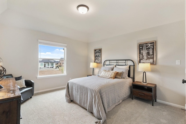 bedroom featuring light colored carpet