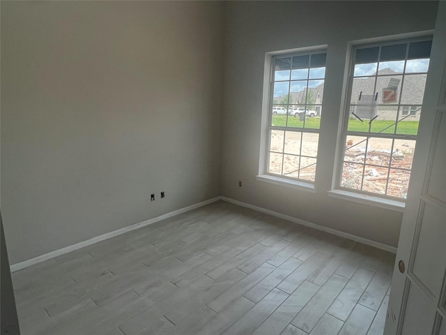 286 Peninsula Point Dr, Montgomery, TX 77356 - spare room with baseboards and light wood-style flooring