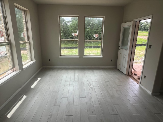 286 Peninsula Point Dr, Montgomery, TX 77356 - empty room featuring healthy amount of natural light and wood finished floors