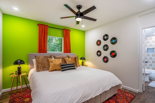 bedroom featuring ceiling fan, ensuite bathroom, and hardwood / wood-style floors