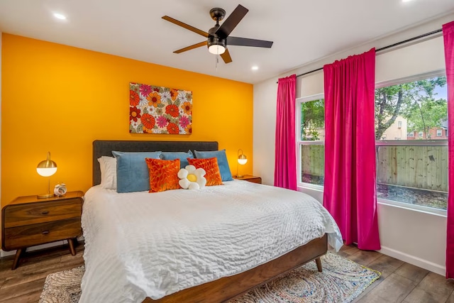 bedroom with wood-type flooring and ceiling fan