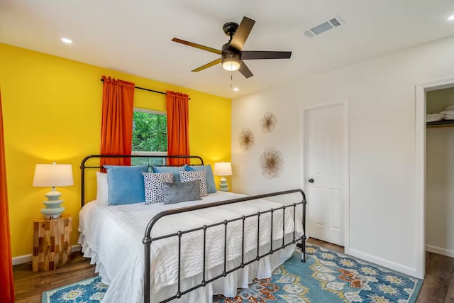 bedroom featuring hardwood / wood-style flooring and ceiling fan