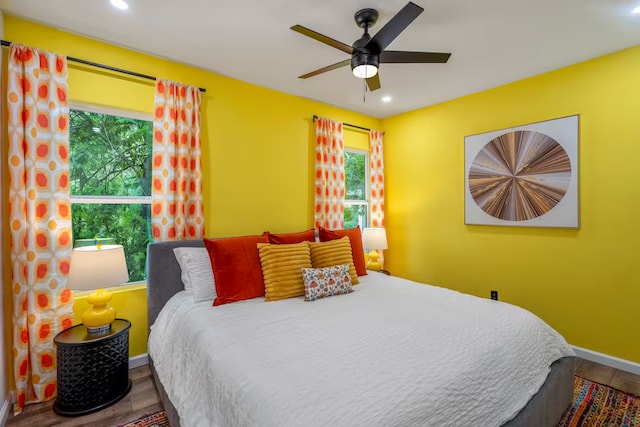 bedroom featuring ceiling fan and wood-type flooring