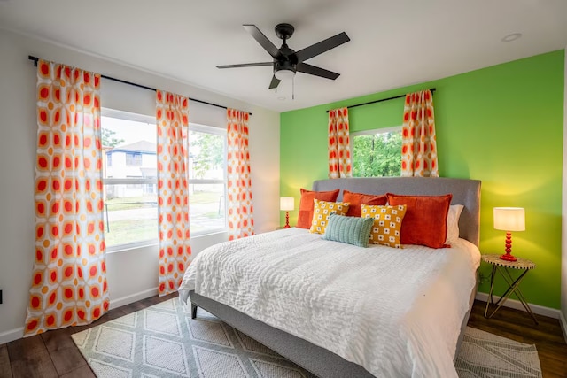 bedroom featuring ceiling fan and dark hardwood / wood-style floors