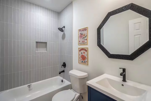 full bathroom with vanity, toilet, and tiled shower / bath combo