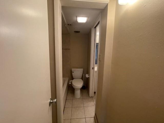 bathroom with tile patterned flooring and toilet