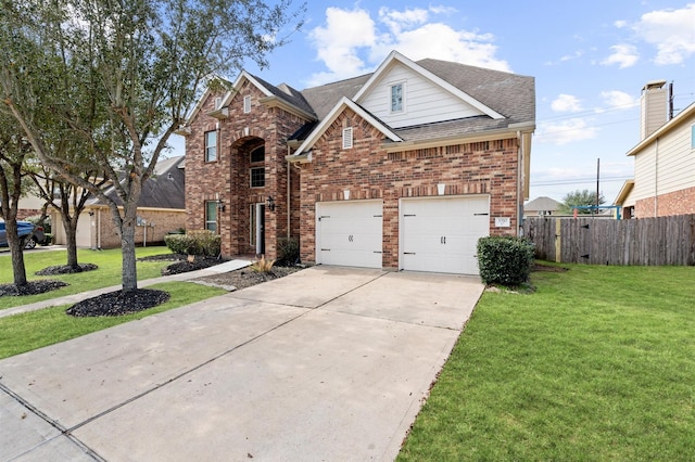 view of front property featuring a garage and a front yard