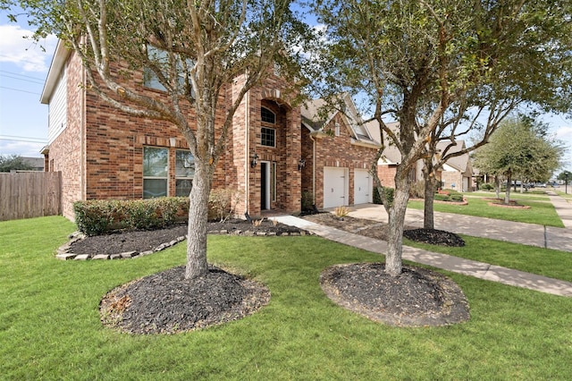 view of front facade with a garage and a front lawn