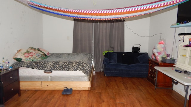 bedroom featuring dark hardwood / wood-style floors