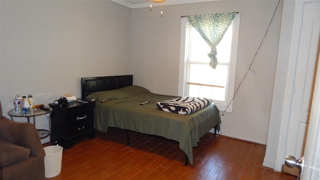 bedroom featuring dark hardwood / wood-style flooring