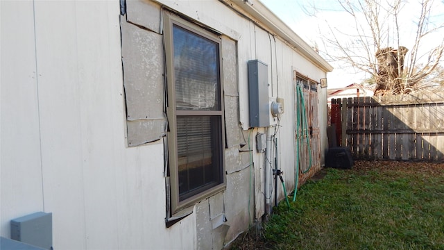 view of home's exterior with electric panel