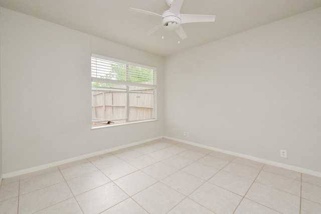 tiled empty room with ceiling fan