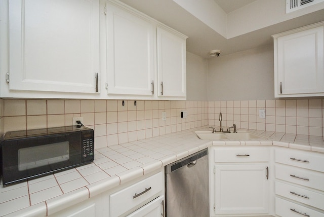 kitchen with white cabinetry and stainless steel dishwasher