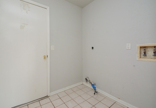 clothes washing area with light tile patterned flooring, electric dryer hookup, washer hookup, and gas dryer hookup