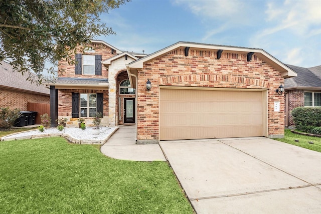 view of front property featuring a garage and a front yard