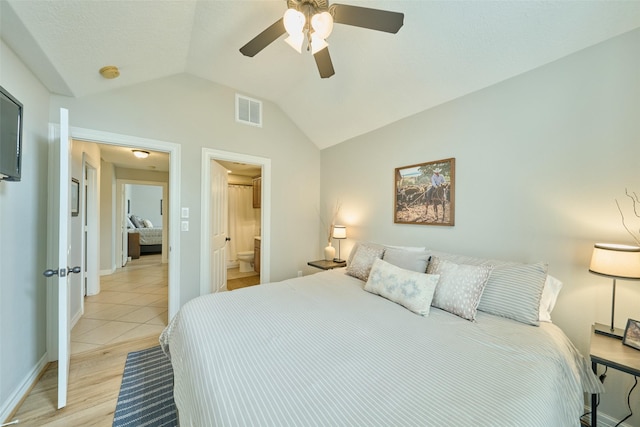 bedroom featuring vaulted ceiling, ceiling fan, and light wood-type flooring