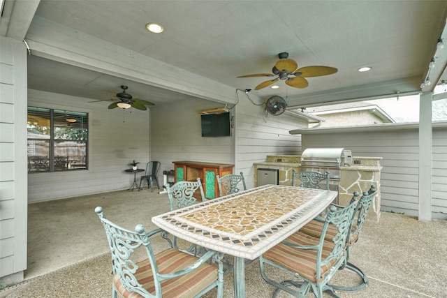 view of patio / terrace featuring an outdoor kitchen, a grill, an outdoor bar, and ceiling fan