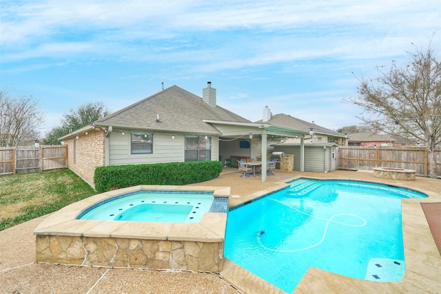 view of swimming pool featuring an in ground hot tub and a patio area