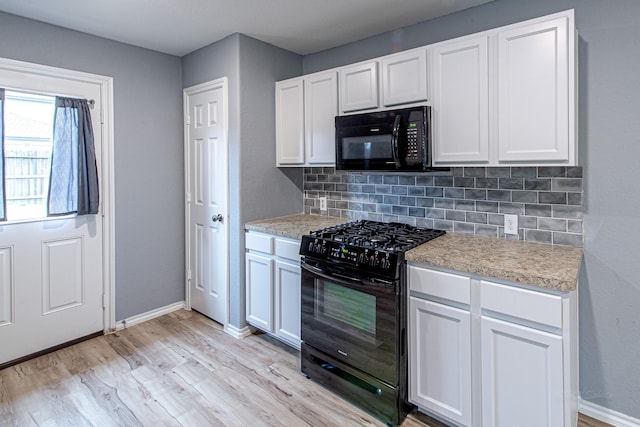 kitchen with backsplash, black appliances, light hardwood / wood-style floors, and white cabinets