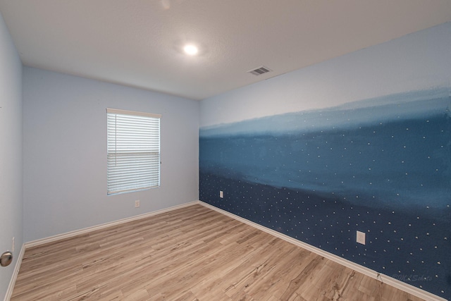 unfurnished room featuring wood-type flooring