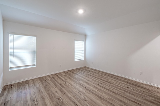 empty room with light hardwood / wood-style floors