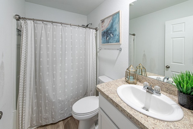 bathroom with vanity, a shower with curtain, wood-type flooring, and toilet