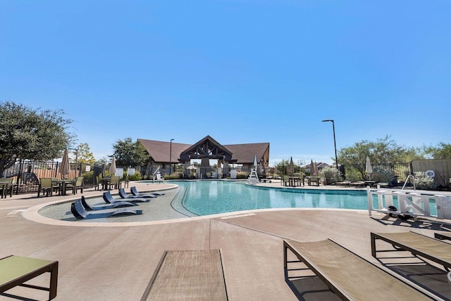 view of swimming pool with a patio