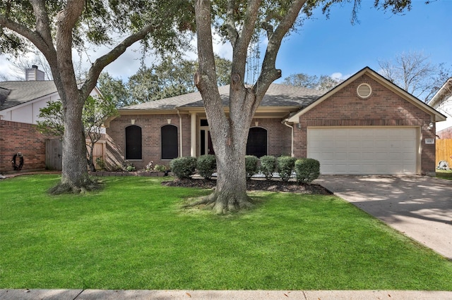 ranch-style home featuring a garage and a front yard