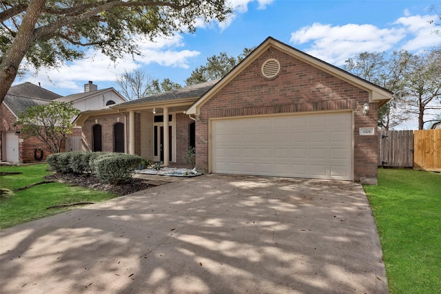 view of front of house with a garage and a front yard