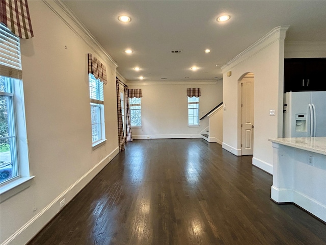 unfurnished living room with dark wood-type flooring and ornamental molding