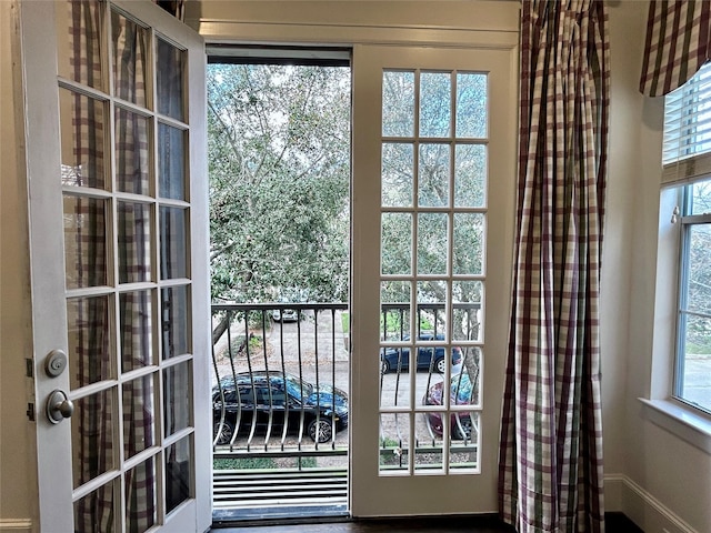 doorway with plenty of natural light and french doors