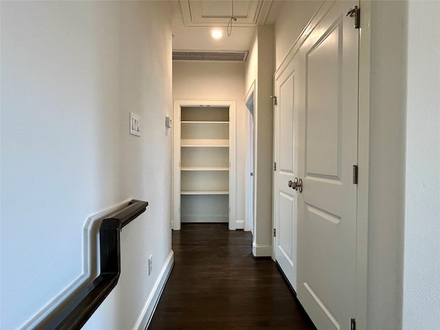 hallway featuring dark hardwood / wood-style flooring