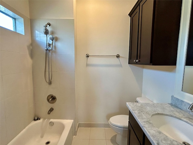 full bathroom with vanity, tiled shower / bath, tile patterned floors, and toilet