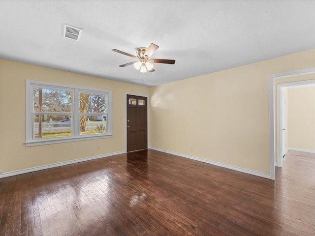 entryway with dark wood-type flooring and ceiling fan