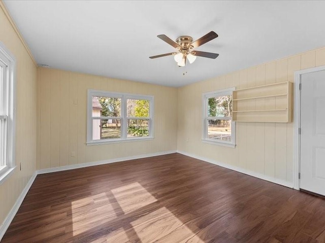 spare room with hardwood / wood-style floors and a wealth of natural light