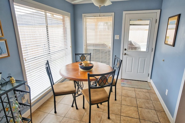 dining area with light tile patterned floors