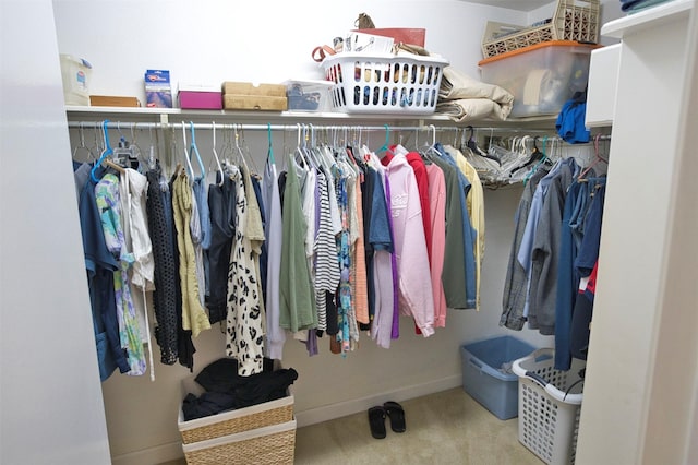 walk in closet featuring carpet