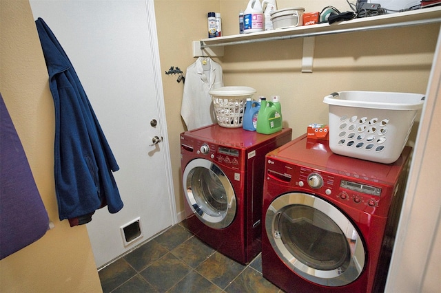 clothes washing area featuring separate washer and dryer