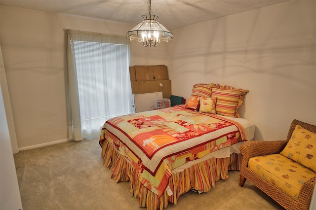 bedroom with light colored carpet, a notable chandelier, and a textured ceiling