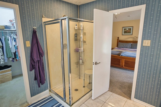 bathroom featuring tile patterned flooring and walk in shower