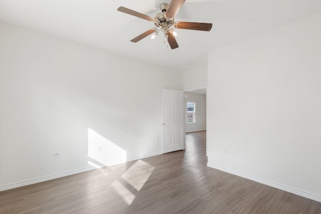 unfurnished room featuring hardwood / wood-style flooring and ceiling fan