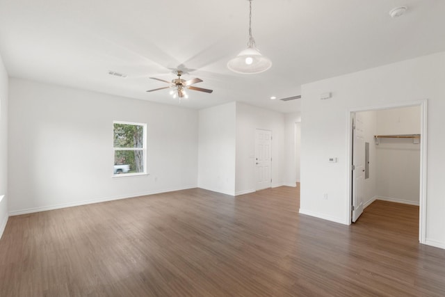 unfurnished room featuring dark hardwood / wood-style floors and ceiling fan