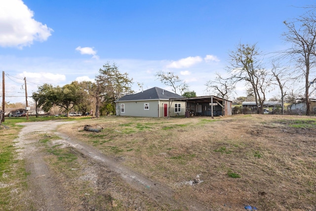 exterior space with a carport